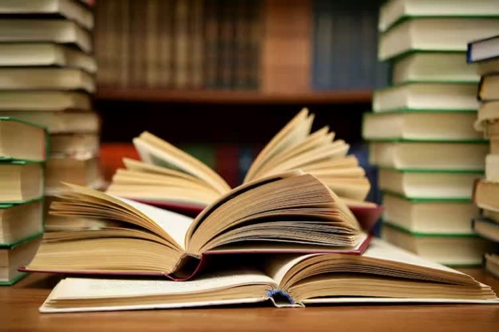 Open book representing academic study